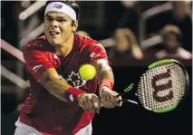  ?? DAVE SIDAWAY ?? Milos Raonic returns a shot from Adrian Mannarino at the Rogers Cup in Montreal on Wednesday. Raonic lost 6-4, 6-4.