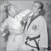  ??  ?? TAKING ON CHUCK: A publicity photo provided by the Las Vegas News Bureau on Wednesday shows actress and singer Debbie Reynolds joking around with US actor and martial artist Chuck Norris at the Stardust in Las Vegas, Nevada, in March 1967. PICTURE: LAS...