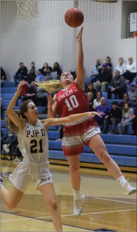  ?? AUSTIN HERTZOG - MEDIANEWS GROUP ?? Owen J. Roberts’ Olivia LeClaire (10) scores on a layup as Pope John Paul II’s Kayla Ciuba chases the play during their PAC playoff game Thursday at Spring-Ford.