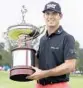  ?? TONY GUTIERREZ/AP ?? Billy Horschel poses with the trophy after winning the Byron Nelson tourney,