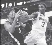  ?? Associated Press ?? Baylor guard Dale Bonner (3) reaches out to block the shot of Virginia guard Armaan Franklin (4) during the first half on Friday in Las Vegas. No. 16 Virginia upset No. 5 Baylor, 86-79.