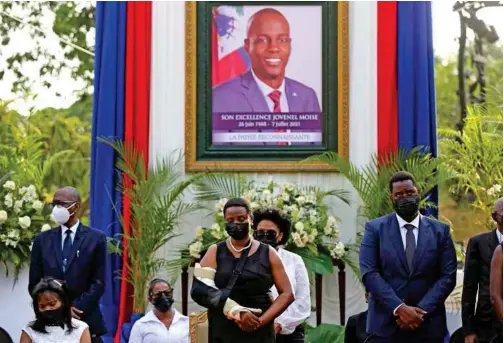  ?? Associated Press ?? First Lady Martine Moise (centre) attends a tribute for her late husband President Jovenel Moise at the National Pantheon Museum in Port-au-prince, Haiti, on Wednesday.