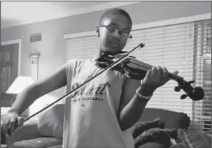  ?? Submitted photo ?? MUSICAL INTERLUDE: Joshua Smith, a sixth-grade orchestra student at Lakeside Middle school, who plays the cello, violin and viola, will provide musical entertainm­ent during wardrobe changes at the “Welcome to Royalty” children’s fashion show being held...