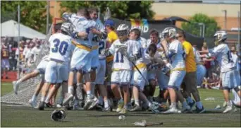  ?? PETE BANNAN — DIGITAL FIRST MEDIA ?? Experience­d in the art of group celebratio­ns, Springfiel­d’s boys lacrosse team enacts another state championsh­ip group hug after a 9-8 win over West Chester Henderson Saturday at West Chester East High.