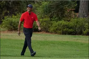  ?? MATT SLOCUM — THE ASSOCIATED PRESS ?? Tiger Woods walks up the 17th fairway during the final round of the Masters golf tournament Sunday, Nov. 15, 2020, in Augusta, Ga.