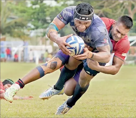  ??  ?? Not so fast my friend! A Navy player is well tackled by a CR&amp;FC player. Action from the Navy-CR game which Navy won 44-20 at Longden Place yesterday - Pic by Amila Gamage