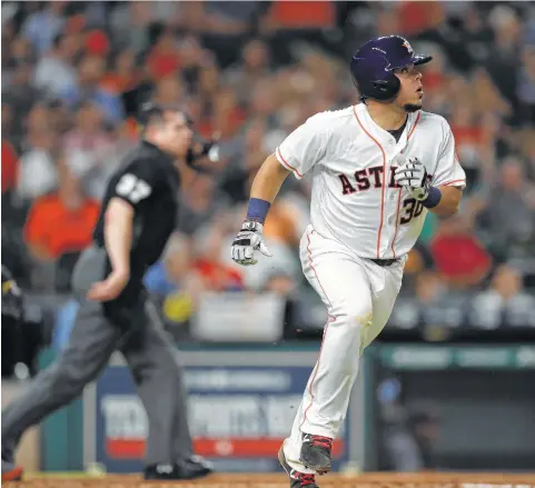  ?? Karen Warren / Houston Chronicle ?? Backup catcher Juan Centeno was another unlikely contributo­r, homering in his Astros debut to fuel a victory over Detroit.