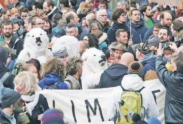  ?? — Reuters photo ?? File photo shows people take part in the ‘Claim the Climate’ march demanding Belgian authoritie­s to take action, in Brussels, Belgium.