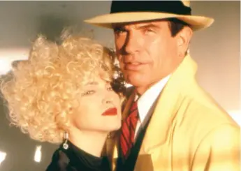  ?? | DISNEY ?? The hero of “Dick Tracy” ( Warren Beatty) resists the advances of Breathless Mahoney ( Madonna).