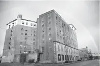  ?? Staff photo by Megumi Rooze ?? ■ A rainbow shines over the Grim Hotel after a rainstorm in this 2011 file photo.