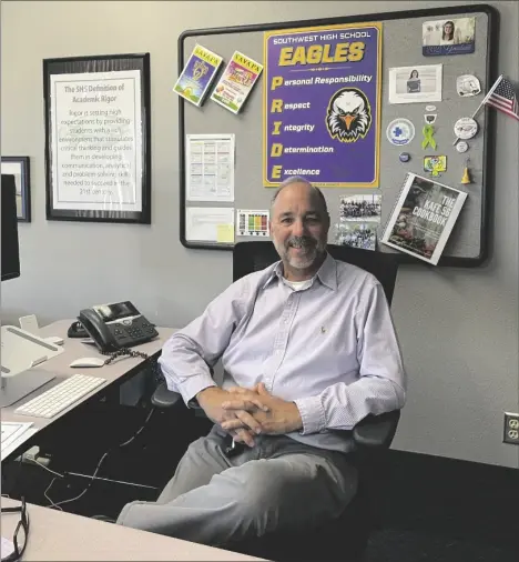  ?? PHOTO ALLYSON AISPURO ?? Retiring Southwest High School Principal Matt Phillips, shown here in his office on March 15.