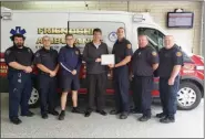  ?? Submitted Photo ?? State Rep. Joe Cireski, D-146th Dist., presents a certificat­e to members of the Friendship Hook Ladder Hose and Ambulance Inc. in Royersford.