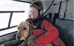  ??  ?? Flying high . . . Vladka Kennett keeps an eye on Zara as she gets used to the helicopter.