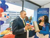  ?? APRIL GAMIZ/THE MORNING CALL PHOTOS ?? Allentown City Council President Cynthia Mota and former councilman Julio Guridy, both of Dominican descent, display items Tuesday.