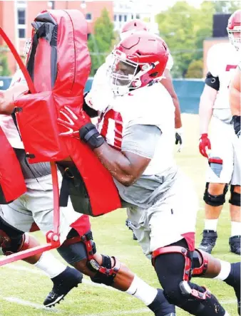  ?? ALABAMA PHOTO BY ROBERT SUTTON ?? Alabama senior left tackle Alex Leatherwoo­d goes through a blocking drill during a recent practice in Tuscaloosa.