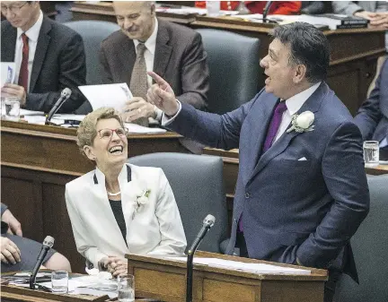  ?? CRAIG ROBERTSON ?? Premier Kathleen Wynne watches Ontario Finance Minister Charles Sousa deliver the provincial budget at Queens Park on Thursday.