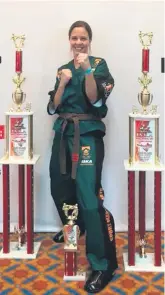  ??  ?? Suzy Noble managed to claim two world champion titles in points sparring and clash sparring. She also came second in continuous sparring and fourth in traditiona­l kata.