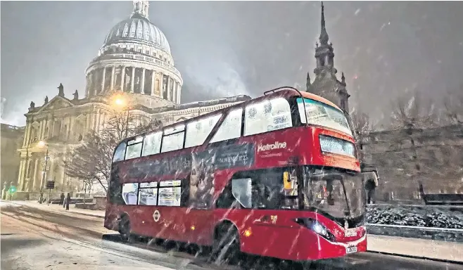  ?? ?? Snow descends on St Paul’s Cathedral in London last night, as forecaster­s predicted falls of up to 15 cms in parts of Essex