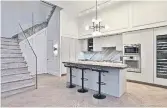  ?? ?? The kitchen has an island/breakfast bar, leathered quartzite counters and Gaggenau appliances.