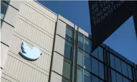  ?? Photograph: Noah Berger/AP ?? A Twitter logo hangs outside the company's San Francisco offices.