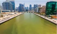  ?? Photo by Neeraj Murali ?? NO CAUSE FOR CONCERN: Discoloure­d water in Dubai Marina was caused by a substance named Bentonite. —