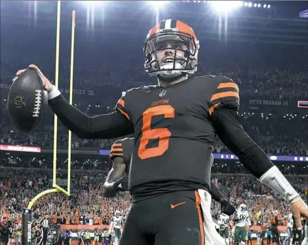  ?? Jason Miller/Getty Images ?? Baker Mayfield not only came off the bench to lead the Browns to victory, but he caught a two-point conversion.