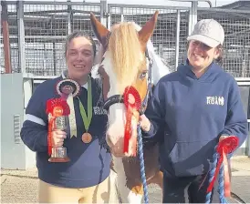  ??  ?? Kirsty Laing celebratin­g with Charlie (horse) and Alys (Wenlo volunteer)