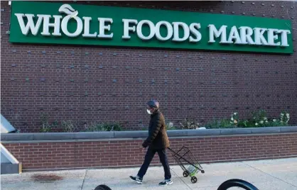  ?? Photograph: Saul Loeb/AFP via Getty Images ?? Whole Foods denied the firing was prompted by the posts, saying it was for a ‘major infraction’.