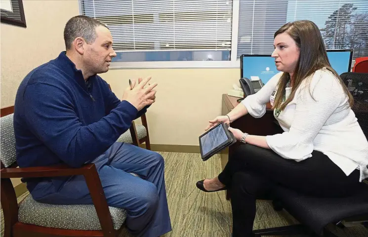  ??  ?? Dr Dranove (left) discussing cancer treatment guidelines with Lenarcic. Dr Dranove tested positive for the breast cancer gene BRCA1 after his uncle was diagnosed with breast cancer and pancreatic cancer.