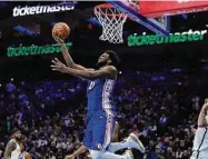  ?? Matt Slocum/Associated Press ?? The Philadelph­ia 76ers’ Joel Embiid goes up for a shot during the second half against the Brooklyn Nets on Wednesday in Philadelph­ia.