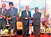  ??  ?? Dr. Riyas Sulaima Lebbe (DBA, MBA, FAAPM, CHRPM) receives certificat­e from Special Assignment­s Minister Dr. Sarath Amunugama