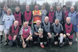  ??  ?? Still game footballer­s Jimmy (back row, extreme right) with some of the other walking