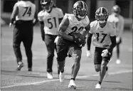  ?? Karl Roster/Handout Photo via USA TODAY Sports ?? Pittsburgh Steelers running back Najee Harris (22) practices at the UPMC Rooney Sports Complex during rookie minicamp, Friday in Pittsburgh.