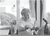  ??  ?? Left: Deng Yaping plays table tennis in her wheelchair in a local hospital. Center: A memorial to the victims of the 7.8 magnitude tremblor. Right: Yang Yufang fixes a lock at his home.