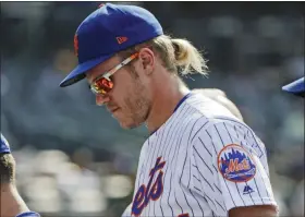  ?? FRANK FRANKLIN II - THE ASSOCIATED PRESS ?? New York Mets starting pitcher Noah Syndergaar­d leaves the field with teammates after a game against the Pittsburgh Pirates Sunday, July 28, 2019, in New York. The Mets won 8-7.