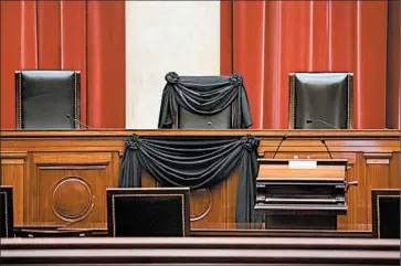  ?? J. SCOTT APPLEWHITE/AP ?? The court chair of the late Justice Antonin Scalia is draped in black as part of a tradition that dates to the 19th century.