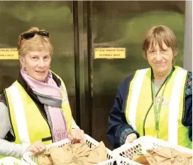  ??  ?? Left: Volunteers Andrea Miller and Eveline Vandervloe­t help out at Baw Baw Food Relief.