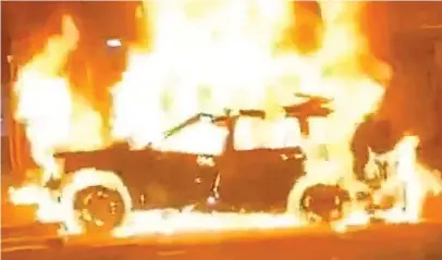  ?? ?? Inferno: Abu Bakr al-Saadi’s car in flames after being destroyed by an American drone