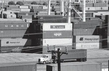  ?? Frederic J. Brown / AFP / Tribune News Service ?? Shipping containers were stacked high at the Port of Los Angeles in April, where records continue to be set for incoming cargo at the nation's No. 1 container port