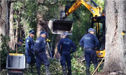  ?? Photograph: Mick Tsikas/AAP ?? NSW Police search an area of bush 1km from the former home of William Tyrrell’s foster grandmothe­r in Kendall