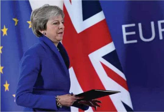  ?? FOTO: REUTERS/NTB SCANPIX ?? Statsminis­ter Theresa May kan nå ta skilsmisse­avtalen med EU opp med Underhuset. Det kan bli en dramatisk kamp å få avtalen godkjent der.