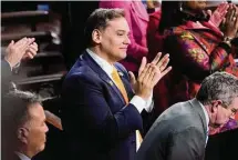  ?? Jabin Botsford/The Washington Post ?? Rep. George Santos, R-N.Y., claps in the House Chamber as President Joe Biden delivers his State of the Union address.