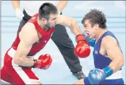  ?? JULIAN FINNEY — GETTY IMAGES/TNS ?? Bakhodir Jalolov, left, of Team Uzbekistan takes on Richard Torrez Jr. of the United States for the super heavyweigh­t title in the final bout of the Tokyo Olympics. Jalolov won 5:0.