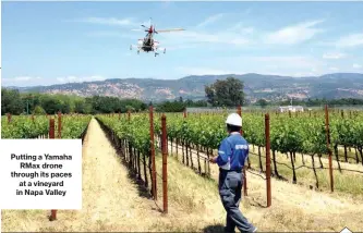  ??  ?? Putting a YamahaRMax drone through its paces at a vineyard in Napa Valley