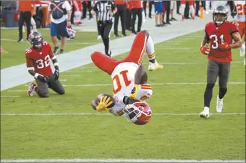  ?? AP photo ?? Chiefs wide receiver Tyreek Hill does a back flip into the end zone to score a touchdown during Kansas City’s 27-24 win over the Tampa Bay Buccaneers on Sunday.