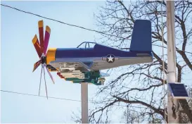  ?? ?? A model of a Vought F4U Corsair rides on the air in the front of Vince Mora’s home. It took three months to make it out of an air compressor and water pressure tanks.