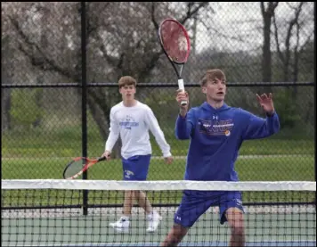  ?? Photo by Luke Gossard ?? Rhett Chisholm and Isaac Wibbeler of St. Marys are shown during a doubles match on Thursday against Kenton.