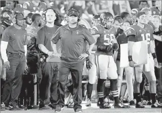  ?? Luis Sinco Los Angeles Times ?? COACH STEVE SARKISIAN looks on as his Trojan squad can’t hold on to a lead and go down to a 38- 34 defeat to the Sun Devils on Saturday at the Coliseum.