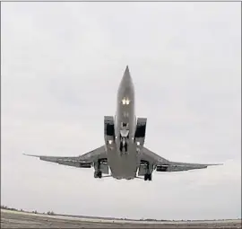  ?? RUSSIAN DEFENSE MINISTRY PRESS SERVICE VIA AP ?? A long-range Tu-22M3 bomber of the Russian Aerospace Forces takes off recently from an airfield in Russia to patrol the airspace of Belarus. A pair of nuclear-capable long-range bombers made the patrol Saturday.