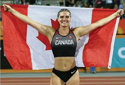  ?? Alysha Newman Twitter ?? Canadian pole vaulter Alysha Newman, who attended UM, is a medal contender at the Tokyo Olympics. ‘It’s cool that I can be both. I can be sexy and powerful and high fashion, but I can also be a blood, sweat and tears Olympic athlete,’ Newman said.